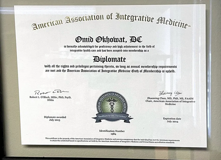 Framed Diplomate certificate from the American Association of Integrative Medicine for Omid Okhowat, DC