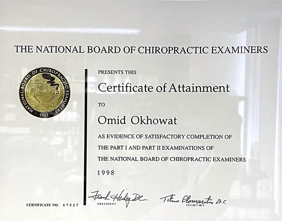 Framed Certificate of Attainment from the National Board of Chiropractic Examiners awarded to Omid Okhowat